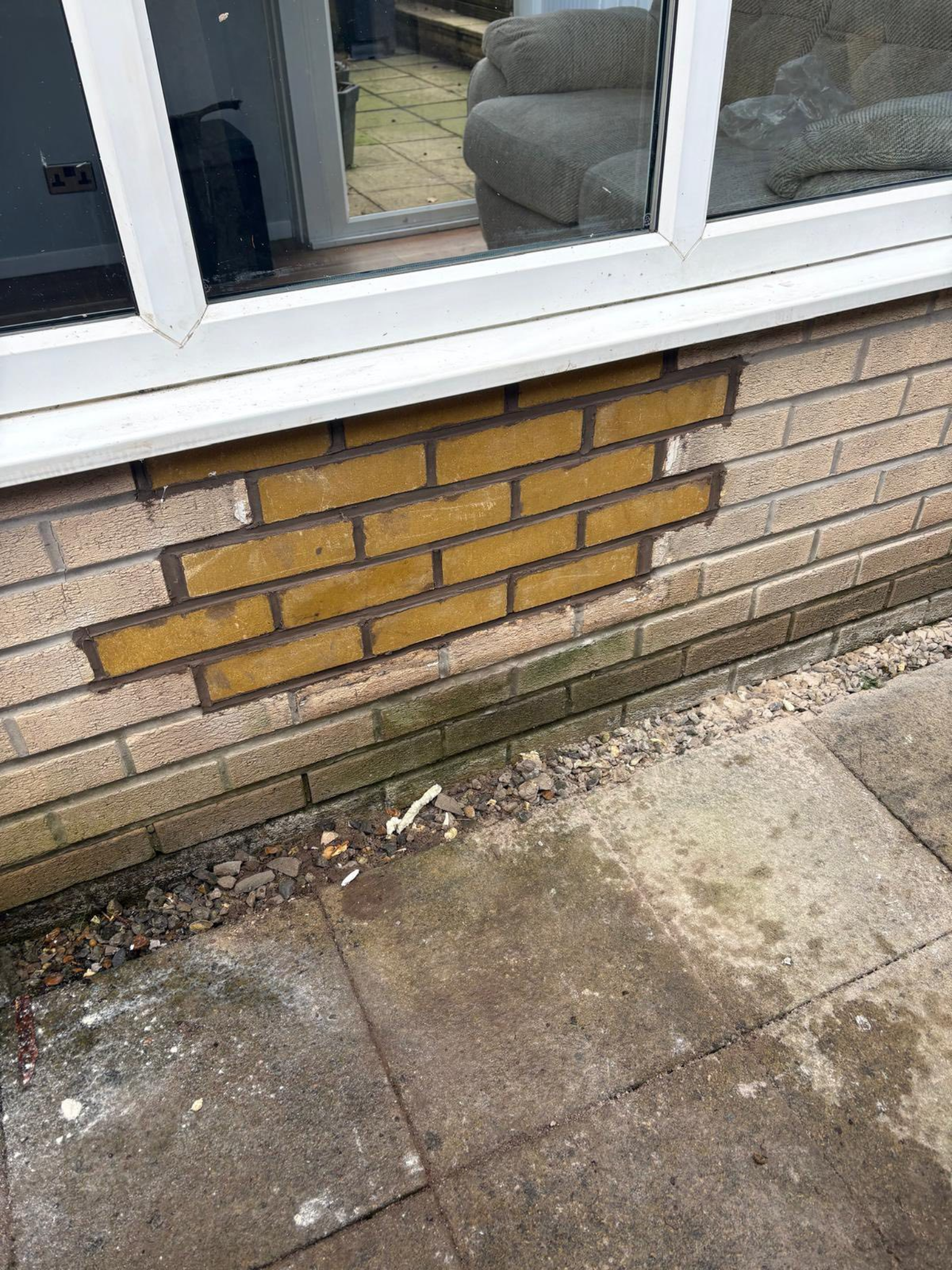 Brickwork repair below window
